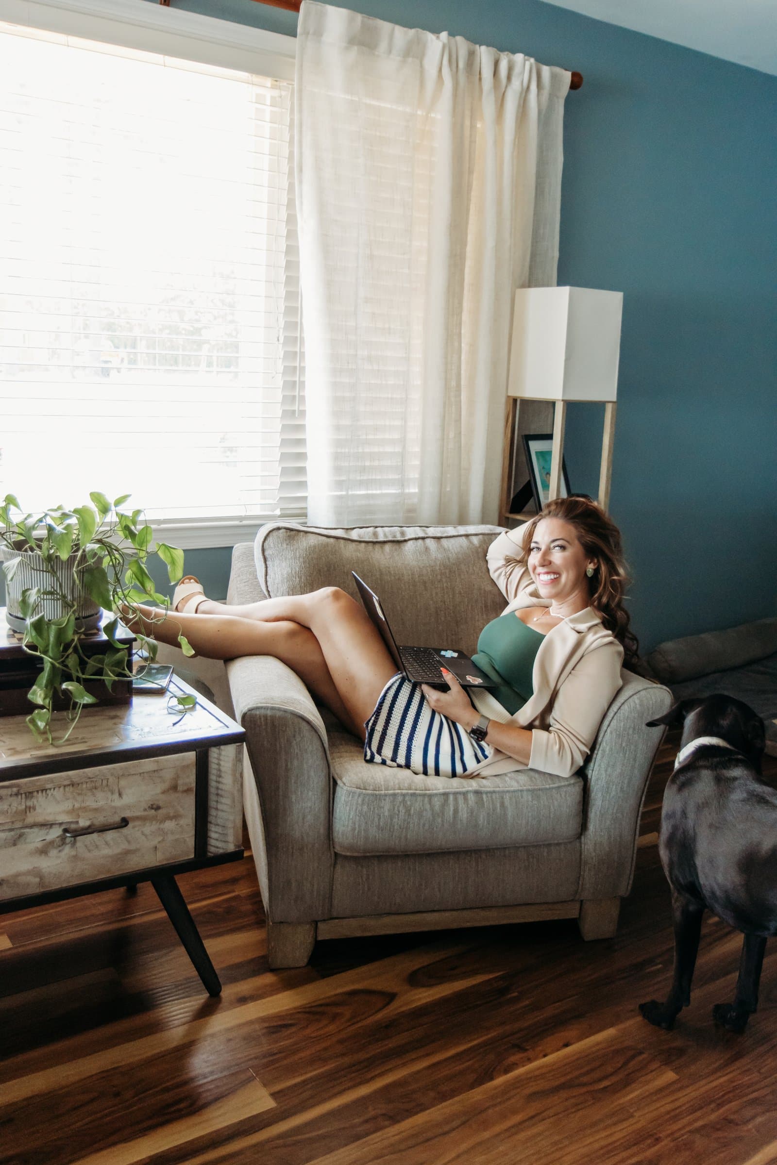 Andrea working from home with real life around her